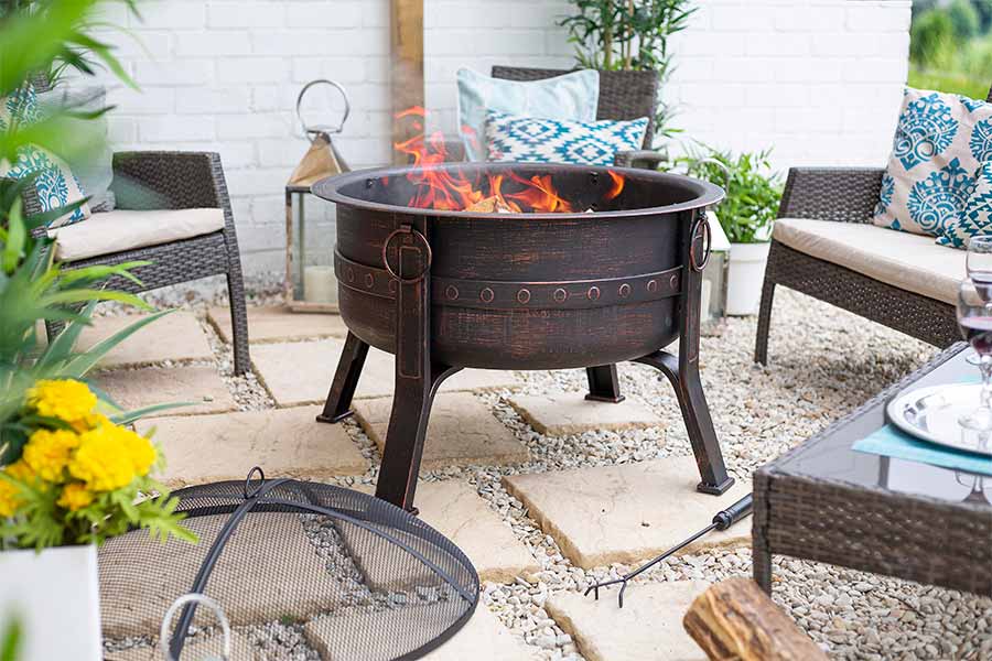 The lovely La Hacienda solid fuel fire pit in a pretty courtyard setting