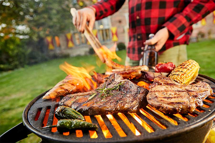 Grilling a selection of meat on a charcoal BBQ