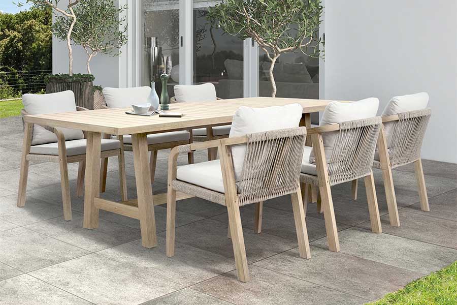 Large Kettler Cora rectangular hardwood dining table with 6 chairs on a modern patio