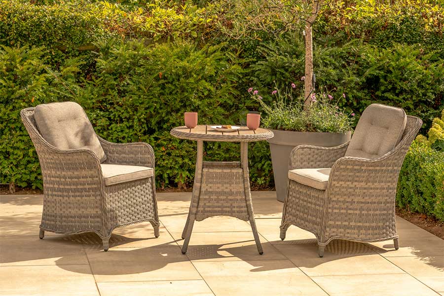 The lovely Kettler Lomond garden bistro set with 2 comfortable armchairs, cushions, and small round table